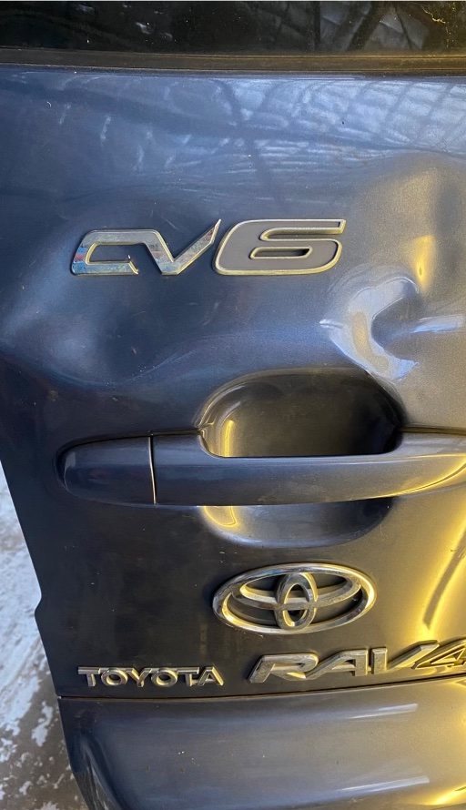 Toyota RAV4 door dent (before repair)
